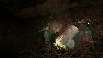 A cave filled with lots of rocks and water photo