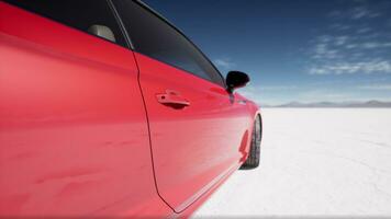 red sport car on the salt lake photo