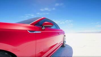 red sport car on the salt lake photo