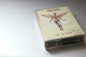 Bangkok, Thailand - 09 February 2022  Nirvana Album's 90s cassette tape In Utero on gray background. photo