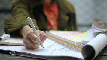 Asian female engineers are working on construction drawings on site. photo