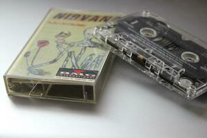 Bangkok, Thailand - 22 January 2022  Nirvana Album Incesticide's 90s cassette tape on gray background. photo