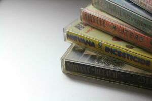 Bangkok, Thailand - february ,09 2022  90's cassette tapes of Nirvana Albums Incesticide, Nevermind, Bleach, From The Muddy Banks of The Wishkah, Unplugged in New York on a gray floor. photo