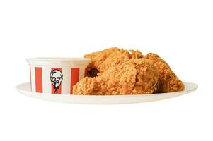 Bangkok, Thailand  August 01, 2022 KFC Chicken, Kentucky Fried Chicken with brand logo, fast food isolated on white background with clipping path. photo