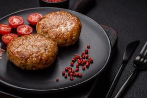 Delicious fresh fried minced fish cutlets with spices and herbs photo