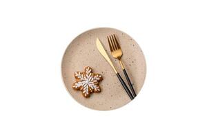 Beautiful festive Christmas composition of an empty plate, tangerine and gingerbreads photo