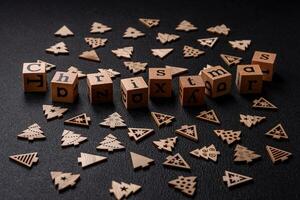 Beautiful Christmas composition with copy space with an inscription in wooden cubes photo