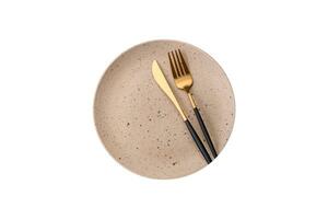 Round empty colored ceramic plate on concrete texture background photo