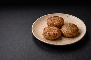 Delicious fresh fried minced fish cutlets with spices and herbs photo