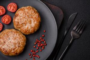 Delicious fresh fried minced fish cutlets with spices and herbs photo