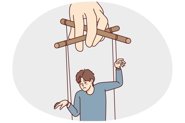 Puppeteer hand manipulating sad man