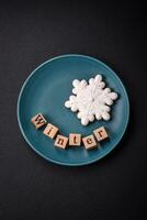 Beautiful Christmas composition with copy space with an inscription in wooden cubes photo