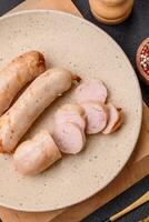 Delicious grilled chicken or pork sausages with salt, spices and herbs photo