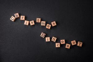 Beautiful Christmas composition with copy space with an inscription in wooden cubes photo