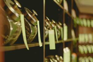 Rack in the store with banks of different tea photo