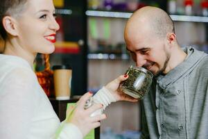 The seller offers to smell tea to the client photo