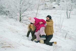 family climbs the hill and having fun photo