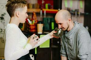 The seller offers to smell tea to the client photo