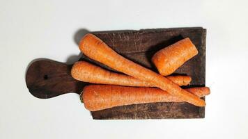 Carrots on a plate for cooking are healthy and carrots contain vitamin A photo