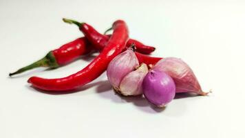 Kitchen spices Red and white onions along with large fresh red chilies photo