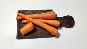 Carrots on a plate for cooking are healthy and carrots contain vitamin A photo