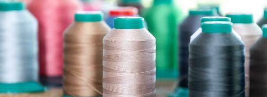 Close up of colorful threads in the leatherworking or tailoring studio photo