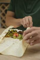 Man cooking homemade falafel meal. photo