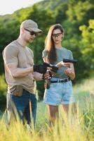 the instructor teaches the girl to shoot a pistol at the range photo