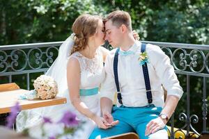 the bride and groom pose for the camera photo