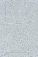 traces on the ice from skates on the rink photo