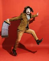 a very positive man with an accordion posing in the studio photo