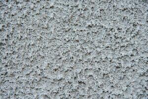 texture of the cement lining on the wall of the house photo