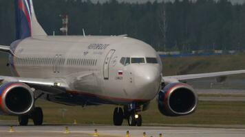 MOSCOW, RUSSIAN FEDERATION JULY 29, 2021 Carrier of Aeroflot taxiing at Sheremetyevo. Footage plane on the taxiway. Tourism and travel concept video