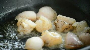 Frying fish pieces in a hot frying pan video