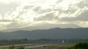 Airplane taking off in the airport runway a cloudy sunset video