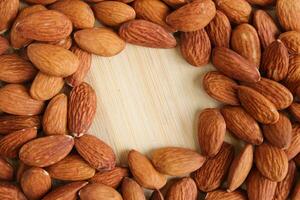 Almond Nuts on Wood Surface photo