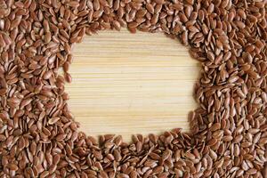 Flaxseeds On Wood Surface photo