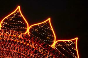 Christmas defocus lights, festive decor elements. City illumination. photo