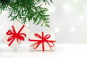 New Year gift boxes and Christmas tree on white background. photo