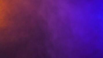 Colorful floating abstract blurred smoke clouds over a black background video