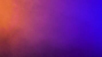 Dynamic moving clouds of colorful smoke over a black background in studio video