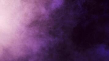 Abstract moving clouds of colorful smoke over a black background in studio. 4K footage video