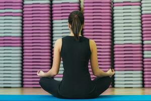 beautiful girl on the mat doing exercise photo