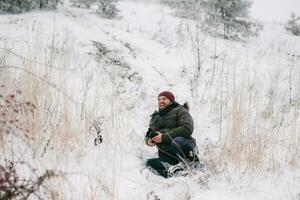 cheerful traveler photographer slipped and fell on snow photo