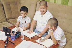 Boys studying together photo