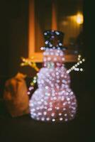 Christmas snowman that stands at the window photo