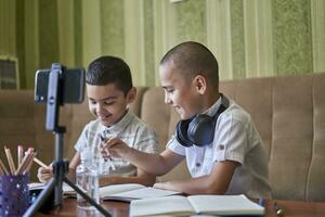 Boys studying together photo