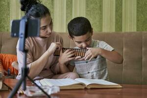 Tutor teaching a child photo