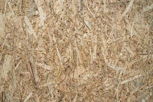 texture of a wooden plate from compressed shavings photo