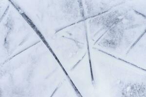 traces on the ice from skates on the rink photo